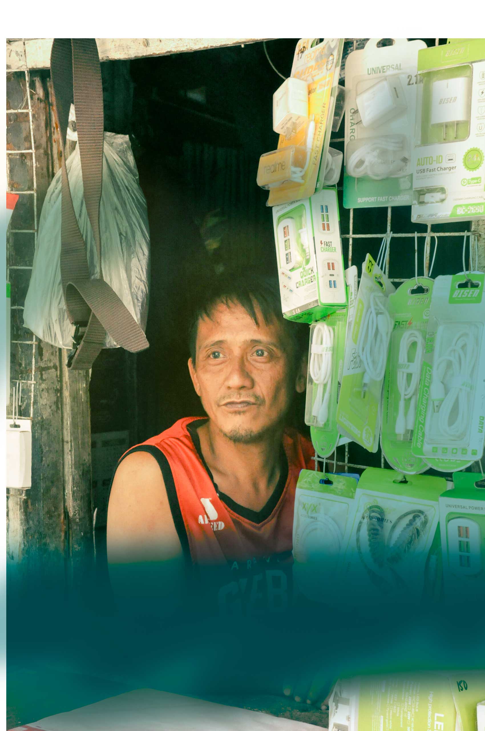 Man in red shirt selling goods - Bagong Bukas